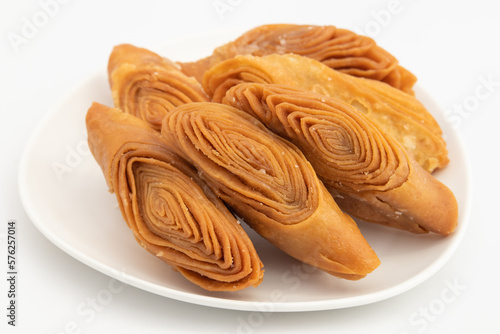 Indian Madatha Thumb Khaja Also Called Gottam Kaja, Badusha, Chirote, Kakinada Kaaja Is Traditional Layered Sweet Puff Pastry Famous In Andhra, Bengal, Gujrat, Bihar, Agra, Odisha, Orrisa In India photo