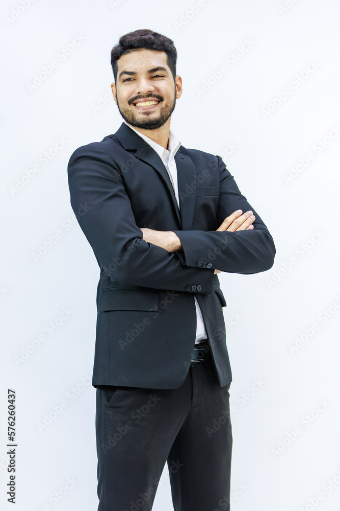 Portrait isolated studio shot Asian Indian professional successful bearded male businessman entrepreneur ceo manager in formal business suit stand smiling crossed arms posing on white background Portrait isolated studio shot Asian Indian professional successful bearded male businessman entrepreneur ceo manager in formal business suit stand smiling crossed arms posing on white background