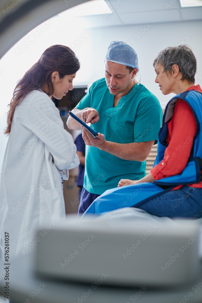 So this is what we found. Shot of a mature woman talking with doctors before and MRI scan. So this is what we found. Shot of a mature woman talking with doctors before and MRI scan.