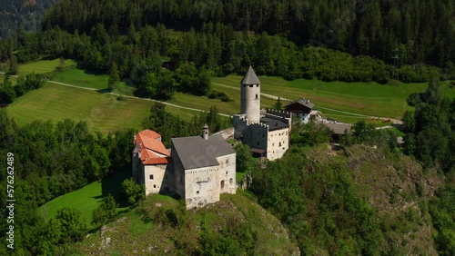 Hilltop Palace With Picturesque Nature Landscape Near Vipiteno In Trentino-Alto Adige, Italy. Aerial Shot photo