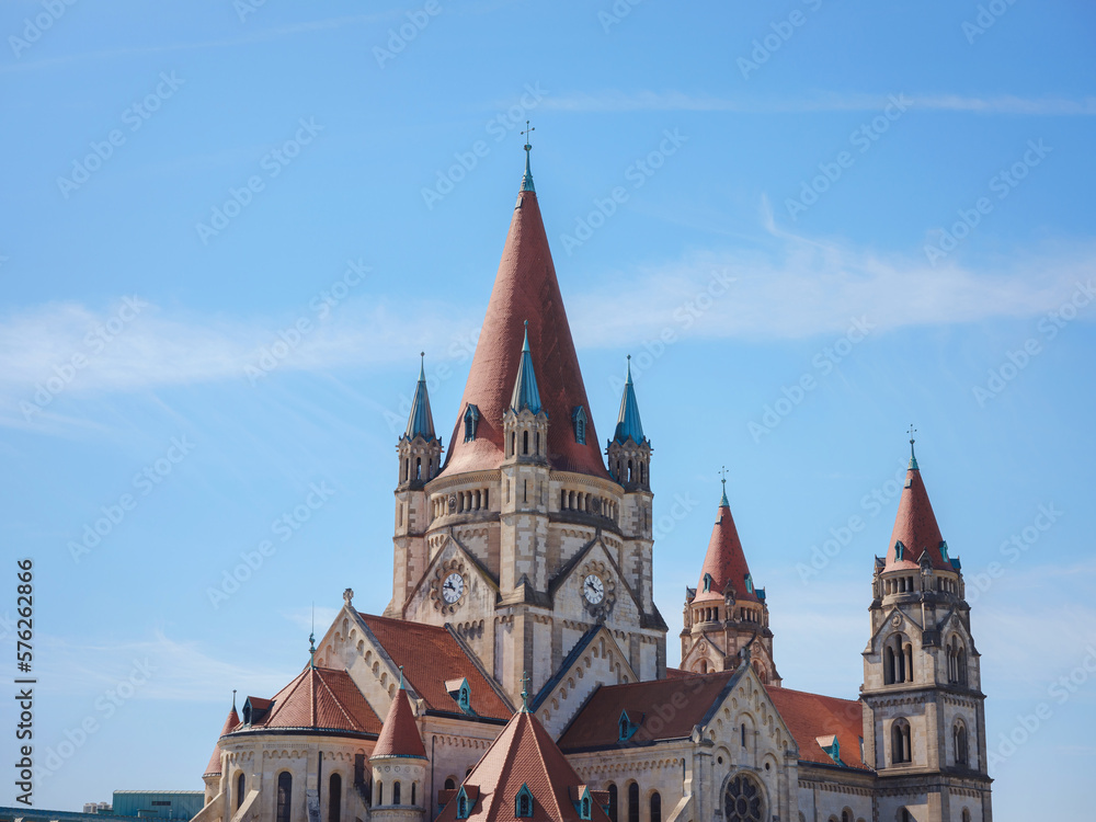 Summer Travel to capital of Austria Vienna. St. Francis of Assisi church or Church Franziska Assizskogo and Danube river embankment in summer