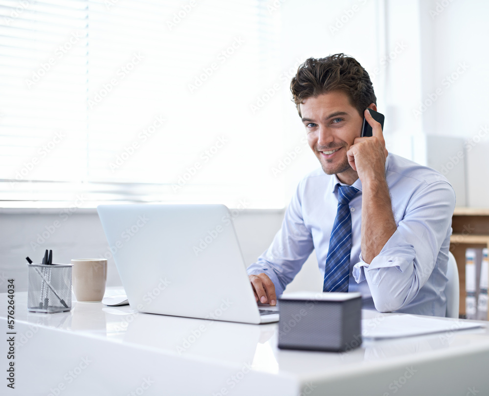 Sure, we can do that for you. A young businessman talking on the phone while seated at his desk. Sure, we can do that for you. A young businessman talking on the phone while seated at his desk.