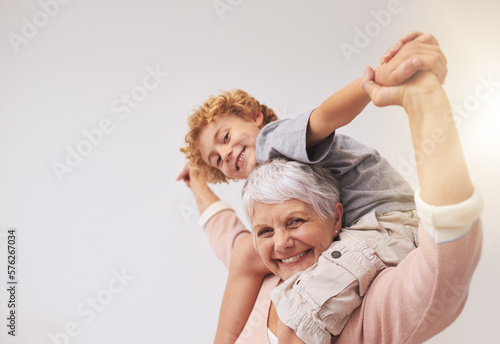 I have the best granny in the whole wide world. Shot of a grandmother giving her grandson a piggyback ride.