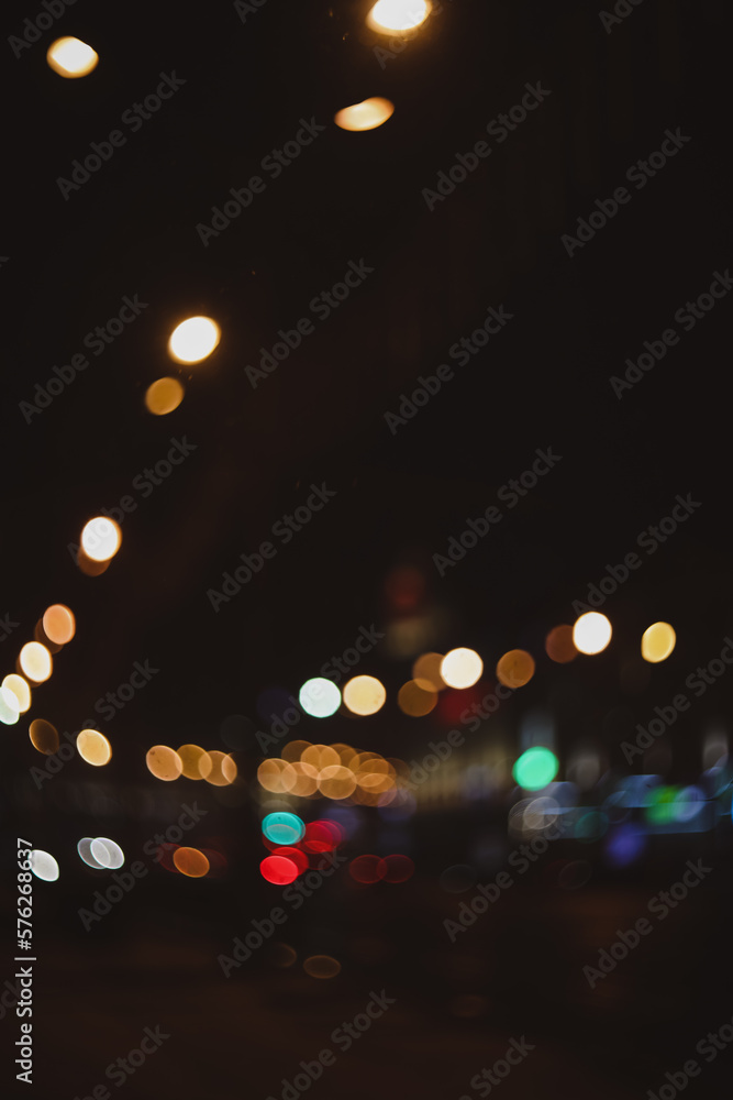 Colorful lights of urban city surrounding moving and blurred by motion. the light trails on the street. Blurred defocused lights of city traffic 