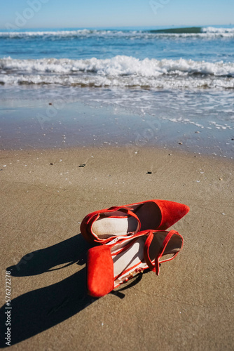 Wallpaper Mural Red high heels  with retro style abandoned in a seashore near the sea Torontodigital.ca
