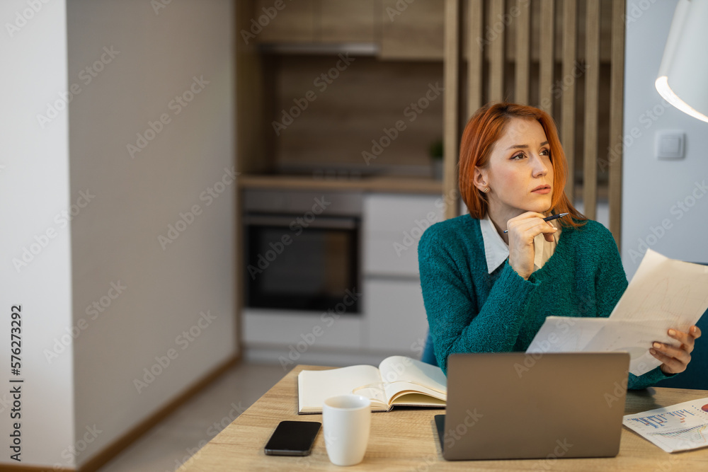 Tired young mother feeling stressed because of financial problems, working from home Tired young mother feeling stressed because of financial problems, working from home