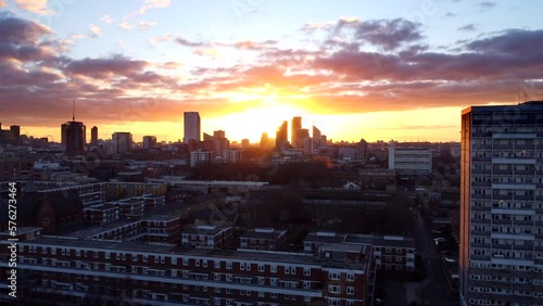 Beautiful sunset over London city skyline. Drone flying over Hackney photo