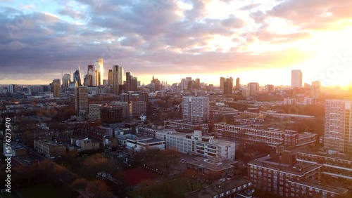 Aerial view intense orange yellow sunset over East London city skyline photo