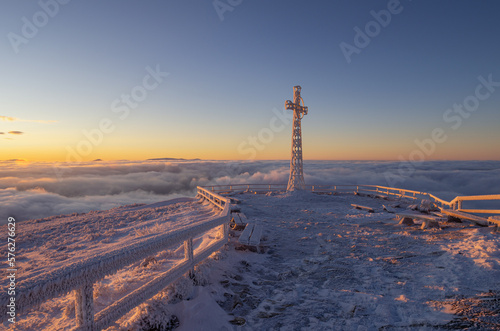 cross on the top of Tarnica in the Bieszczady Mountains on a frosty winter morning