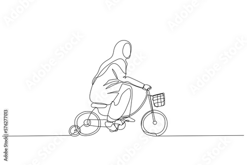 muslim woman practice riding child bicycle with training wheels concept of training practice for success