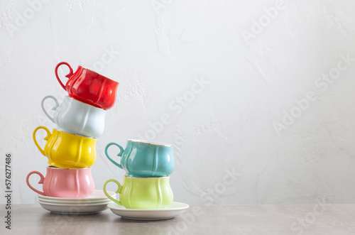 Fototapeta Naklejka Na Ścianę i Meble -  group of different cups on wooden table on white background