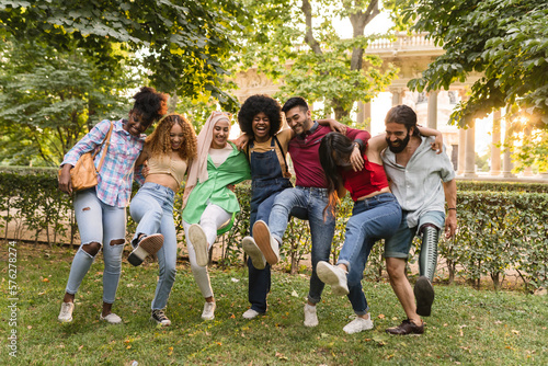 group of friends taking smiling selfie. Group of young people having fun together outdoors in the city park enjoying vacation travel. dancing.