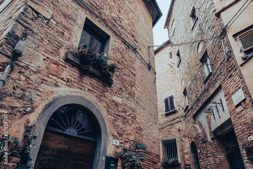Fototapeta Naklejka Na Ścianę i Meble -  Medieval buildings in an alley of a village built in the mountains in Tuscany