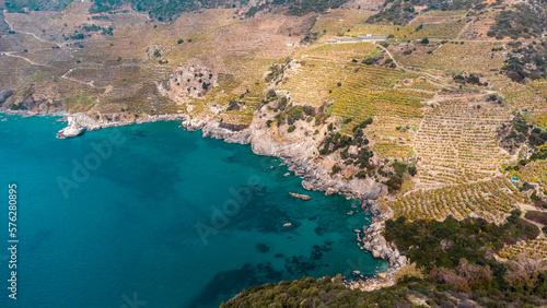 Turquoise bay and banana plantations on mountainside from a bird's-eye view. 