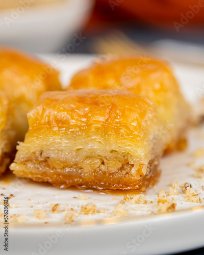 Pistachio baklava on white marble. Traditional middle eastern dessert. Turkish Antep baklava.