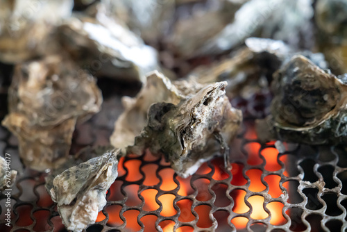 Grilled fresh oyster in Taiwan, famous street food. photo