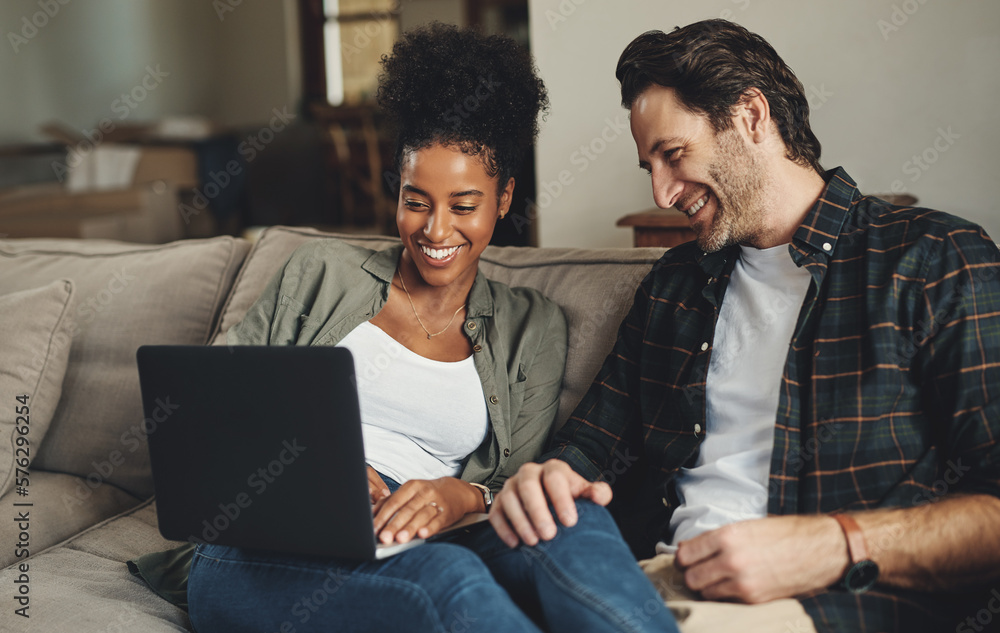 Were updating all our blogs today. Shot of a happy young couple using a ...