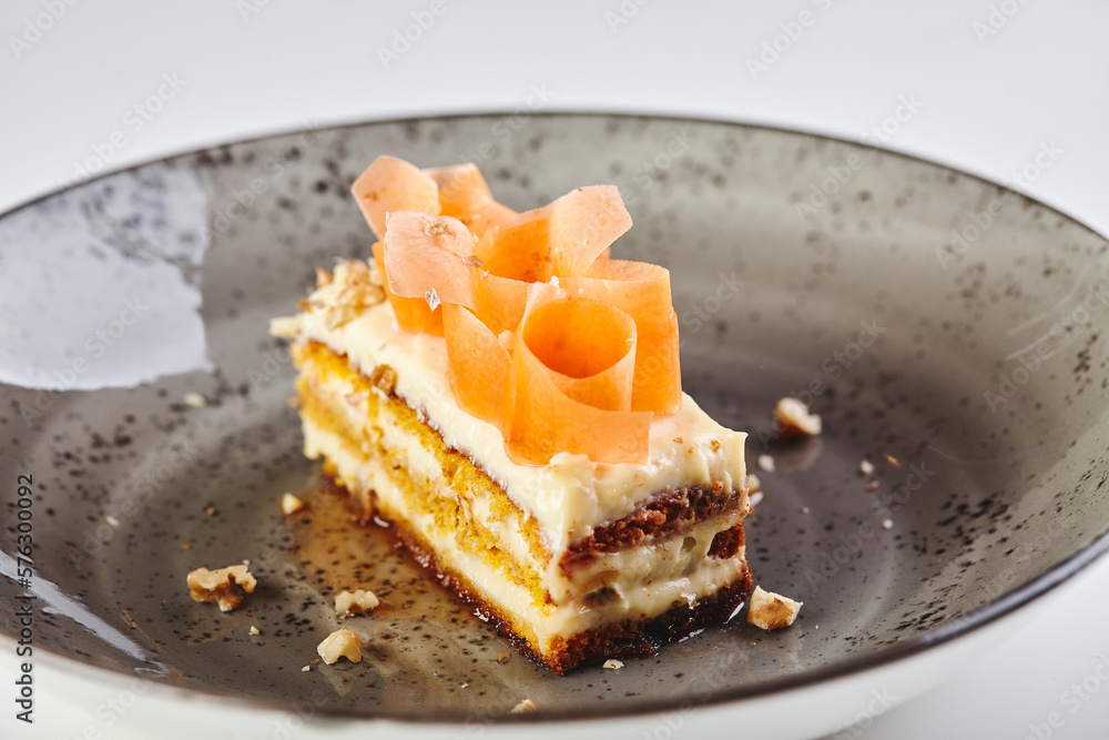 Slice of Carrot Cake in plate close-up on white background Slice of Carrot Cake in plate close-up on white background