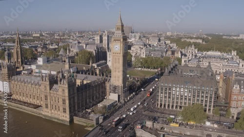 High angle aerial drone shot flying towards Westminster and Big Ben over the River Thames