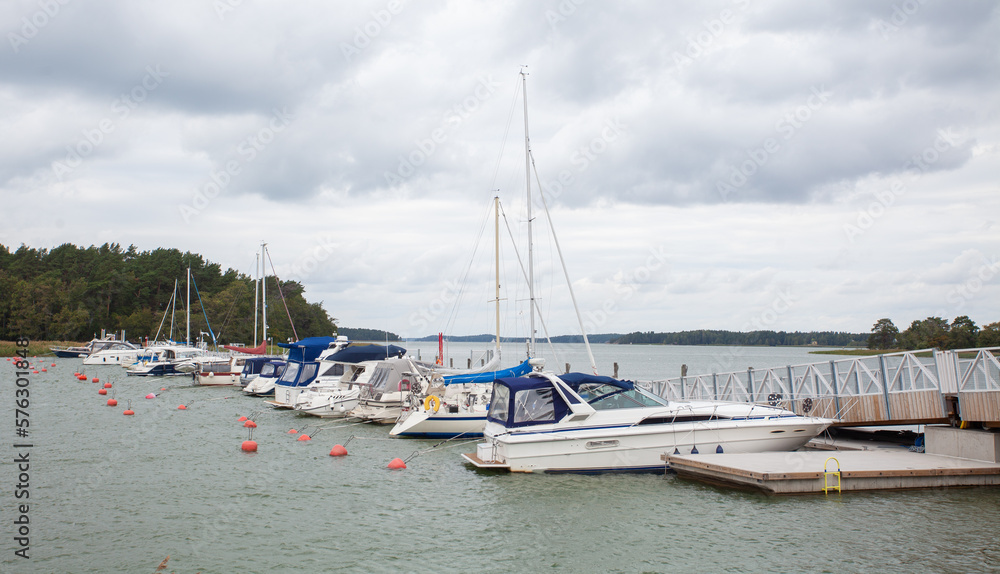 Yachts and boats on pier, autumn Yachts and boats on pier, autumn