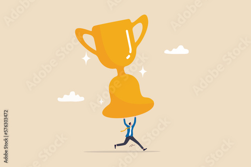 Big success or achievement, winning large business scale or challenge and effort to win award concept, confidence businessman entrepreneur carrying big winner trophy.