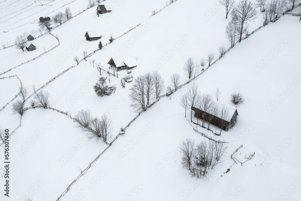 Winter landscape in rural Transylvania. Snowy scene in the Romanian mountains Winter landscape in rural Transylvania. Snowy scene in the Romanian mountains