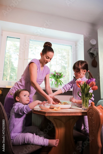 Happy loving family preparing bakery together in the kitchen.  © Irina Magrelo