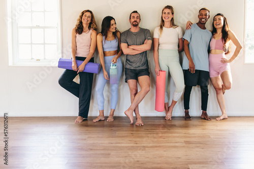People standing together in a yoga studio