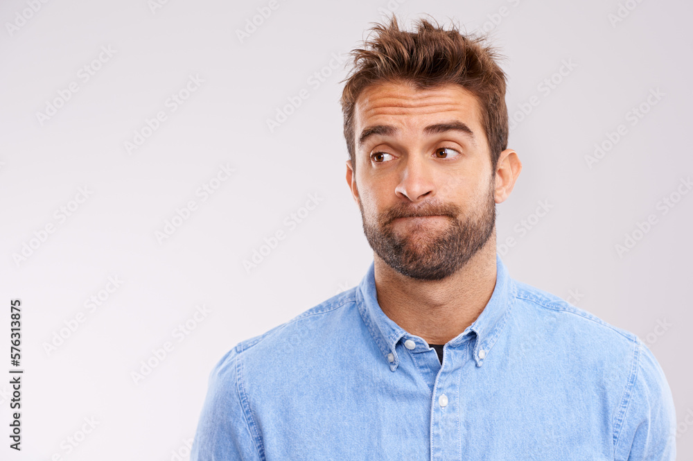 Uhhhmm.... A studio shot of a handsome man making a face. Uhhhmm.... A studio shot of a handsome man making a face.