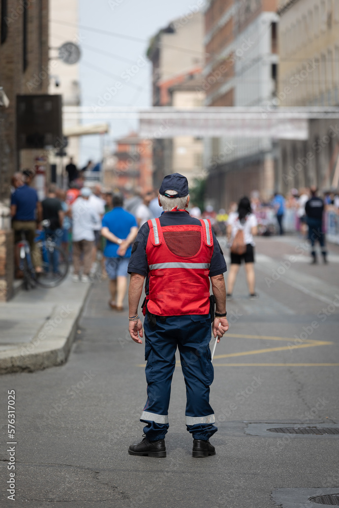 Security and Traffic Control Officer with His Paddle during an Event in a City Street