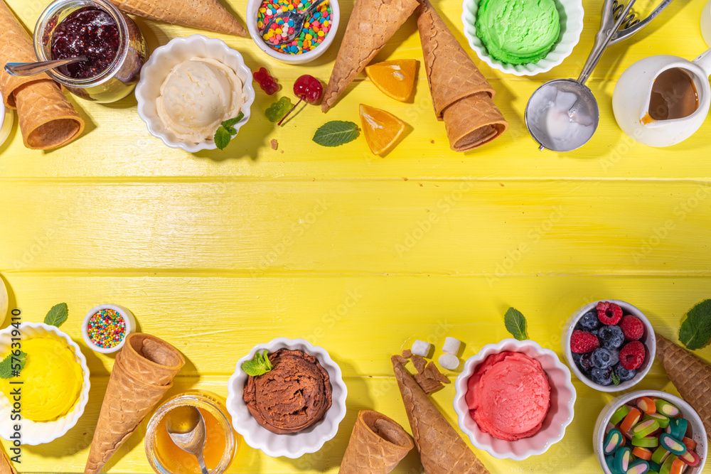 Ice cream festival background, Summer ice cream buffet with various gelato sundaes flavors. sweet toppings and sprinkles, high-colored yellow wooden background to view copy space Ice cream festival background, Summer ice cream buffet with various gelato sundaes flavors. sweet toppings and sprinkles, high-colored yellow wooden background to view copy space