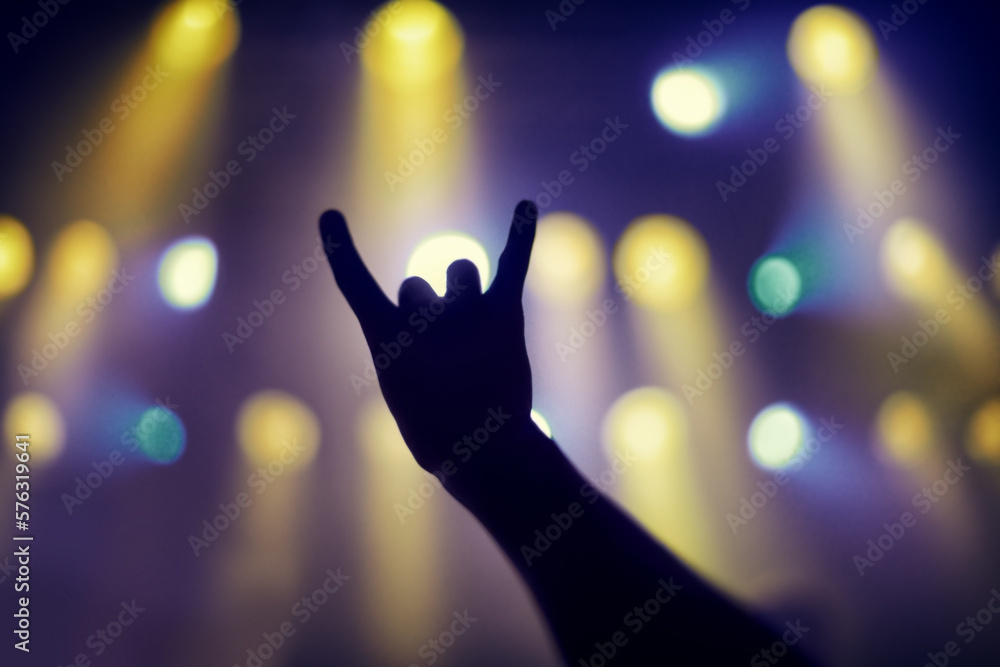 Cropped shot of a persons hands at a music concert. This concert was created for the sole purpose of this photo shoot, featuring 300 models and 3 live bands. All people in this shoot are model Cropped shot of a persons hands at a music concert. This concert was created for the sole purpose of this photo shoot, featuring 300 models and 3 live bands. All people in this shoot are model