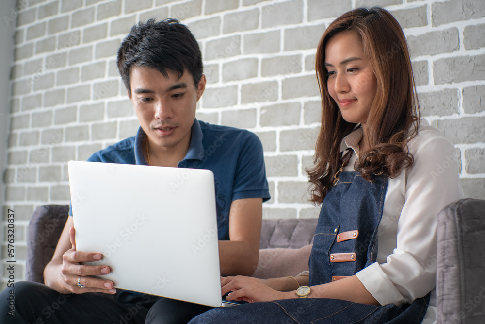 Business man and woman working in office wioth laptop brainstorm business plan