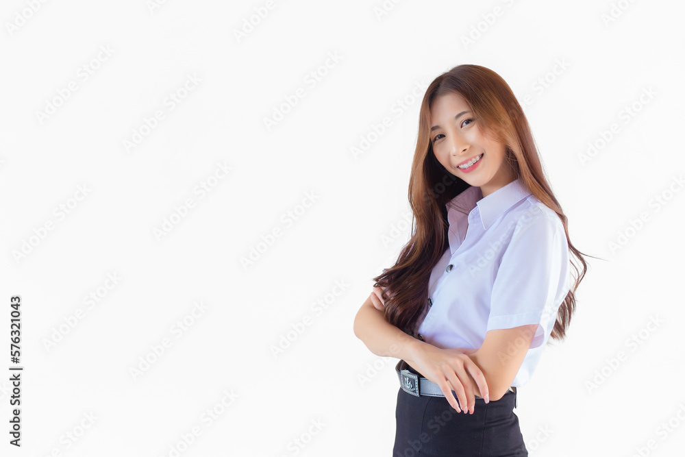 Portrait of an adult Thai student in university student uniform. Asian cute girl standing with her arms crossed confidently isolated on white background. Portrait of an adult Thai student in university student uniform. Asian cute girl standing with her arms crossed confidently isolated on white background.