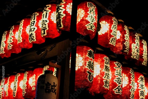 Atmospheric shot of red glowing Japanese lanterns.