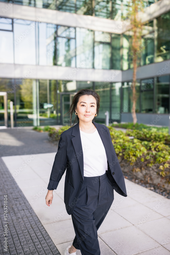 Asian confident business woman in suit walking. Job, work concept Asian confident business woman in suit walking. Job, work concept