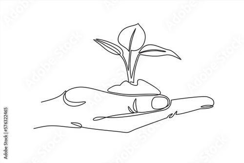 Continuous one line drawing of back to nature theme with hand holding a plant. Concept of growing and love earth.