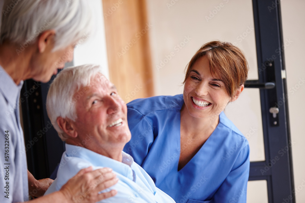 Fototapeta premium Receiving the best care available. Cropped shot of a female nurse standing by her senior patient and his wife.