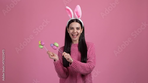 Nice pretty young lady play with easter eggs isolated pastel color background photo