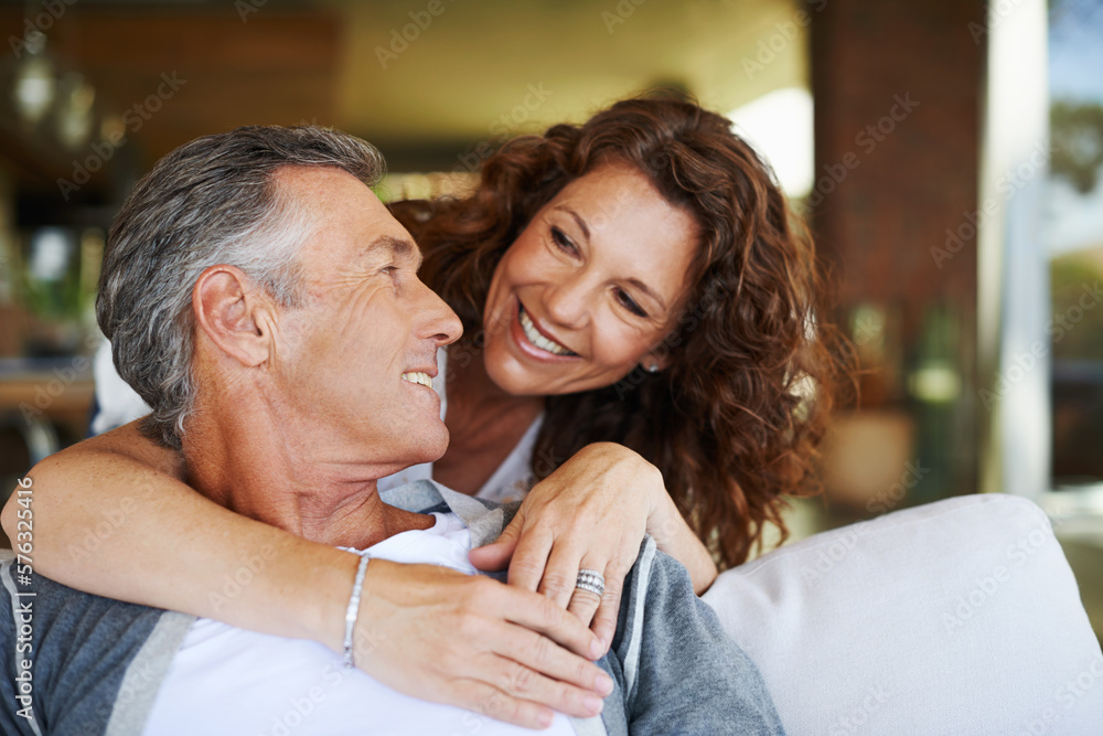 I love you. A handsome mature man being lovingly embraced by his smiling wife. I love you. A handsome mature man being lovingly embraced by his smiling wife.
