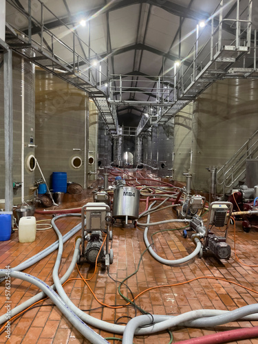 Robertson, Western Cape, South Africa. 2023.  Fermentation tanks in a wine cellar being cleaned before this years wine harvest. Robertson region. photo