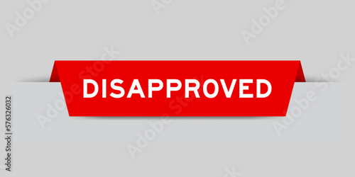 Red color inserted label with word disapproved on gray background