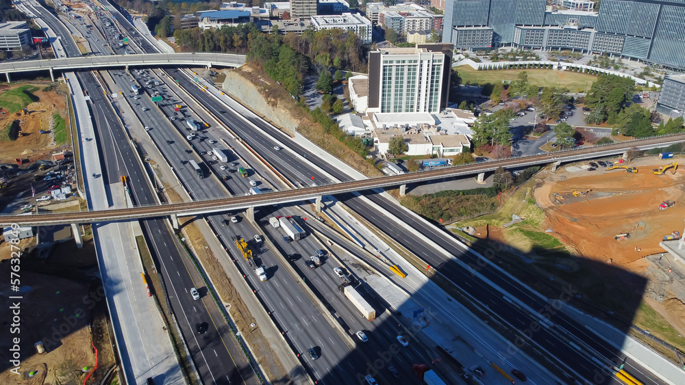 Skytrain railway, elevated bypass, busy traffic on Highway I-285 (the Perimeter), large construction site in midtown Atlanta, Georgia, USA