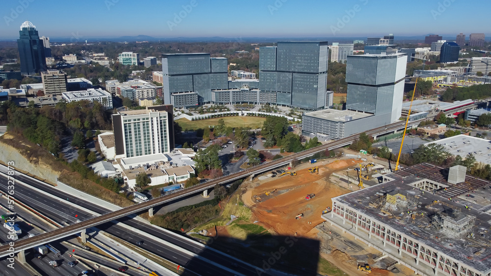 Fototapeta premium Large construction sites of high-rise office buildings and highway along Interstate 285 (the Perimeter) and Ashford Dunwoody road in midtown Atlanta, Georgia, USA