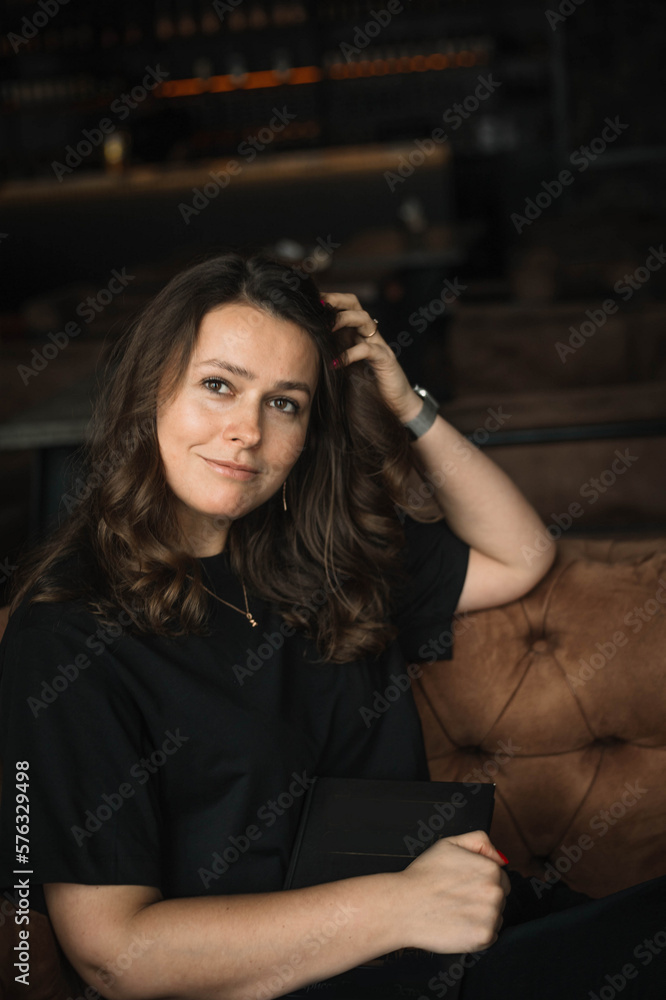 young woman with a book in a cafe, the concept of learning and self-education in psychology young woman with a book in a cafe, the concept of learning and self-education in psychology