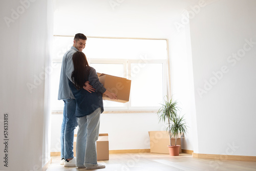 Family Housing Concept. Young Couple Moving To Their New Home