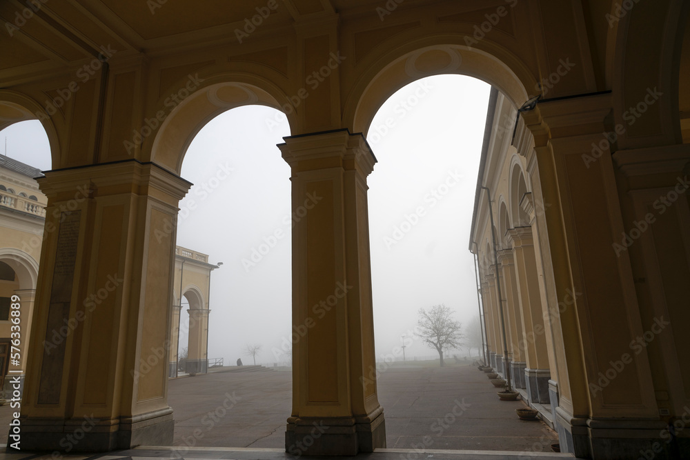 Fototapeta premium The porch of the Sanctuary of Our Lady of the Guard (Madonna della Guardia) in the fog, in Genoa, Italy.
