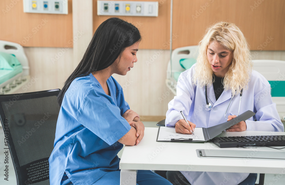 Fototapeta premium Beautiful white female doctor, dermatologist, touches patient's face, takes care of facial skin before treating facial skin in a white and bright skin in a hospital.