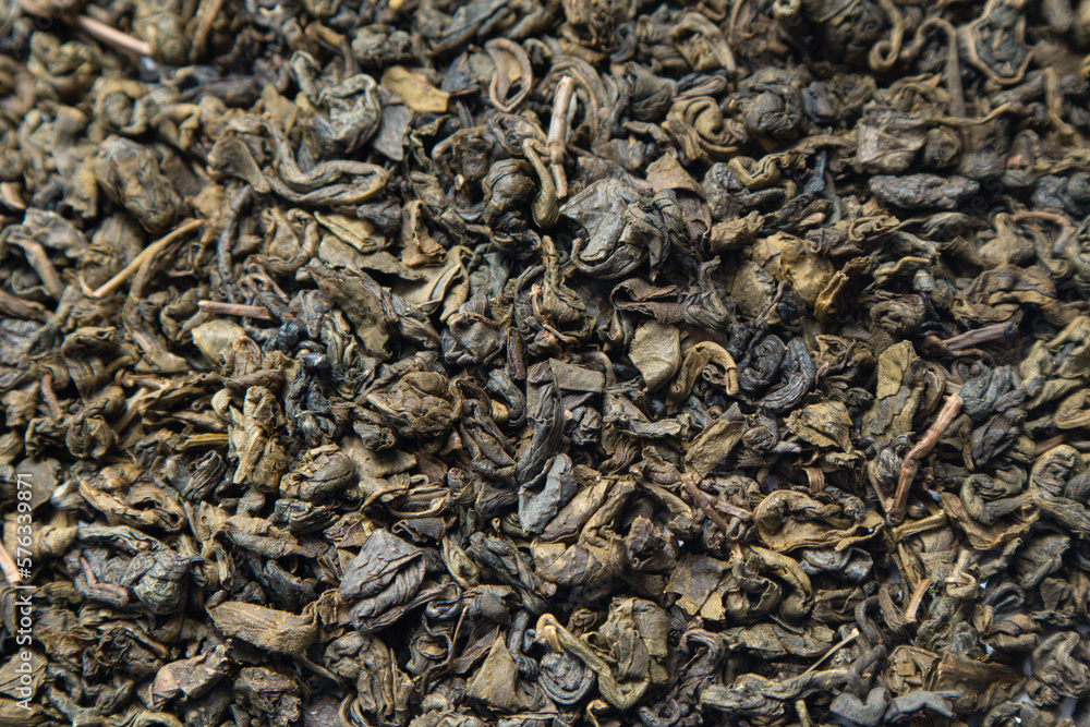 Green Tea background. Close-up shot of dry green tea Green Tea background. Close-up shot of dry green tea