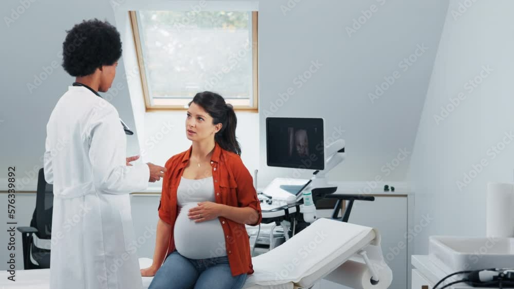 Young pregnant woman at doctors. Young pregnant woman at doctors.